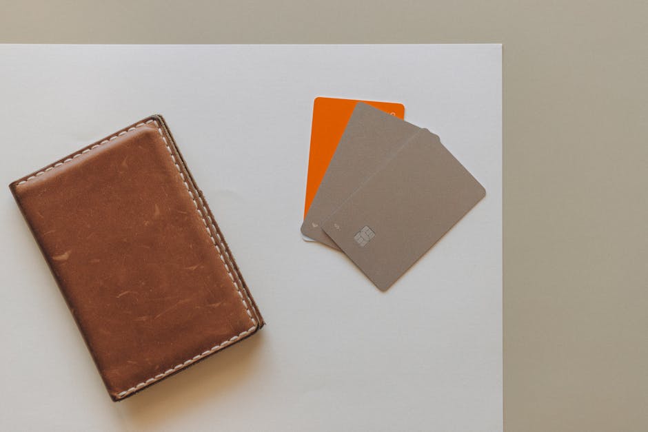 pexels photo 8062357 8062357 A leather wallet and credit cards on a minimalist background, ideal for financial themes.